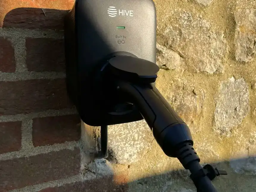 Hive EV charger installed on a brick wall